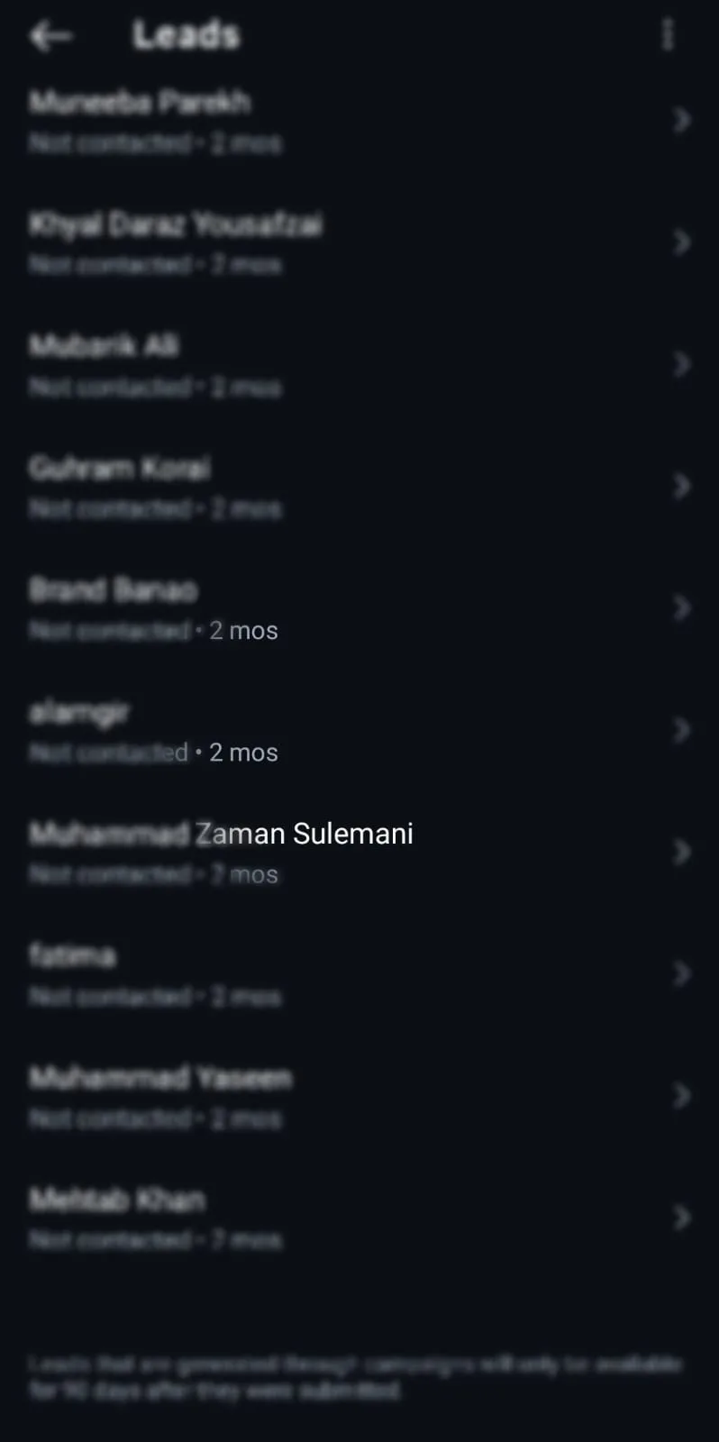 List of leads with names and last contacted dates on a dark screen