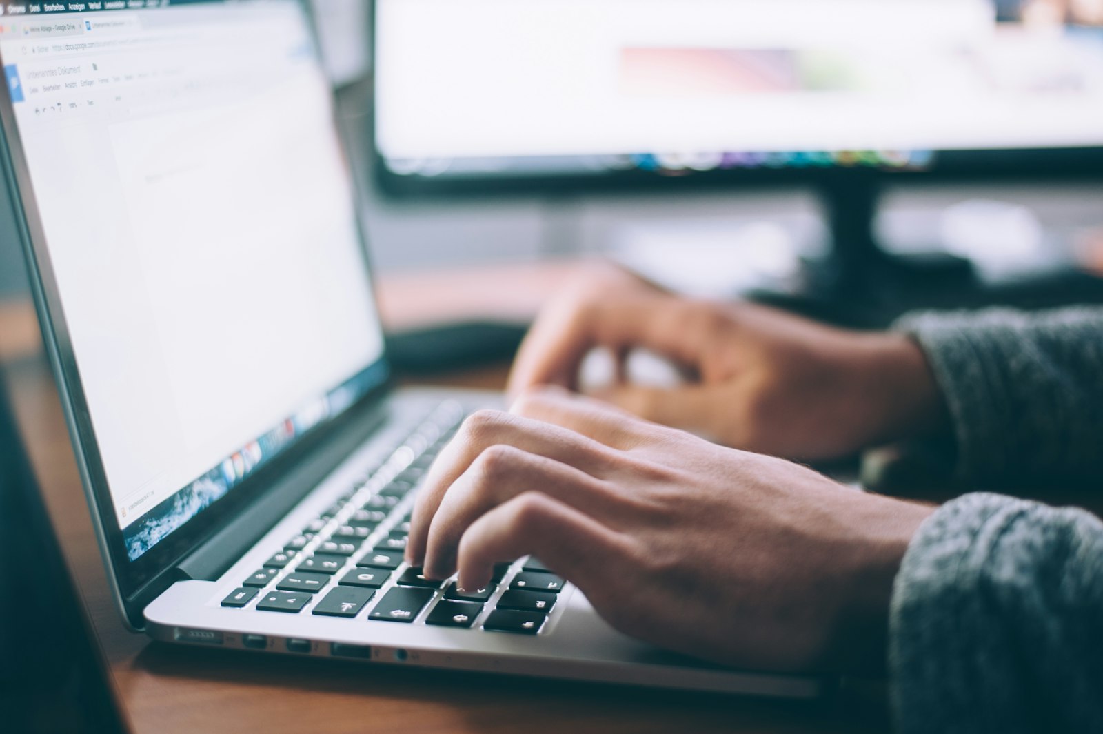 Laptop and notebook on a desk for website planning